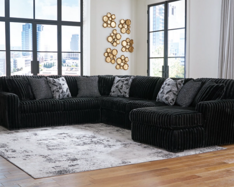 Plush channel-tufted sectional in a warm modern living room